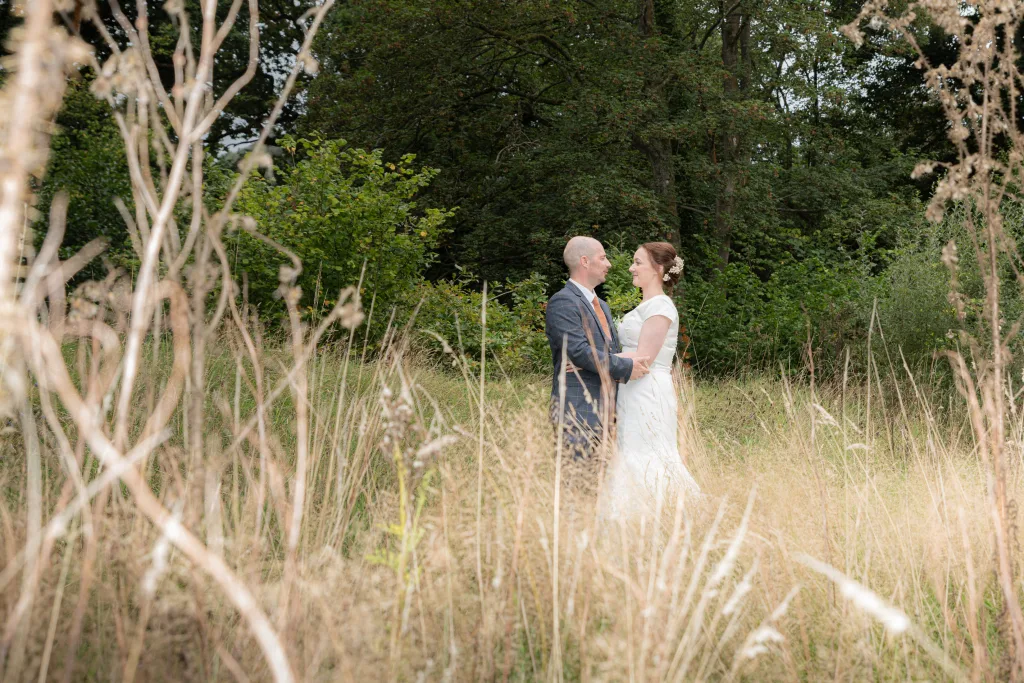 Photographer captures bride and groom embracing at Hackness Grange.