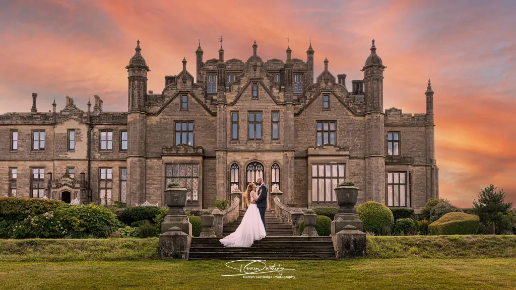 Couple together at sunset in the grounds of Allerton Castle, Yorkshire