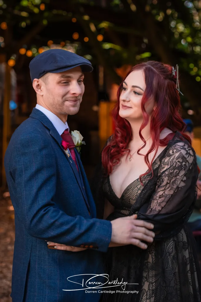 Bride and groom sharing a light embrace at the end of their wedding ceremony at a Yorkshire wedding