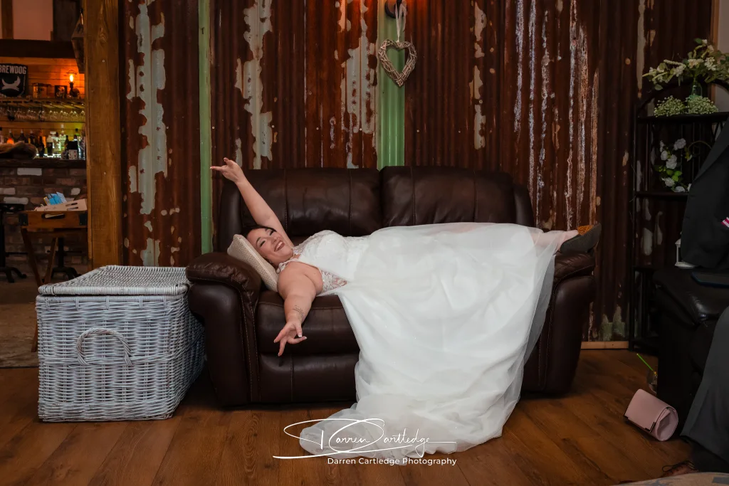 Bride taking a quiet moment during a barn wedding in Yorkshire