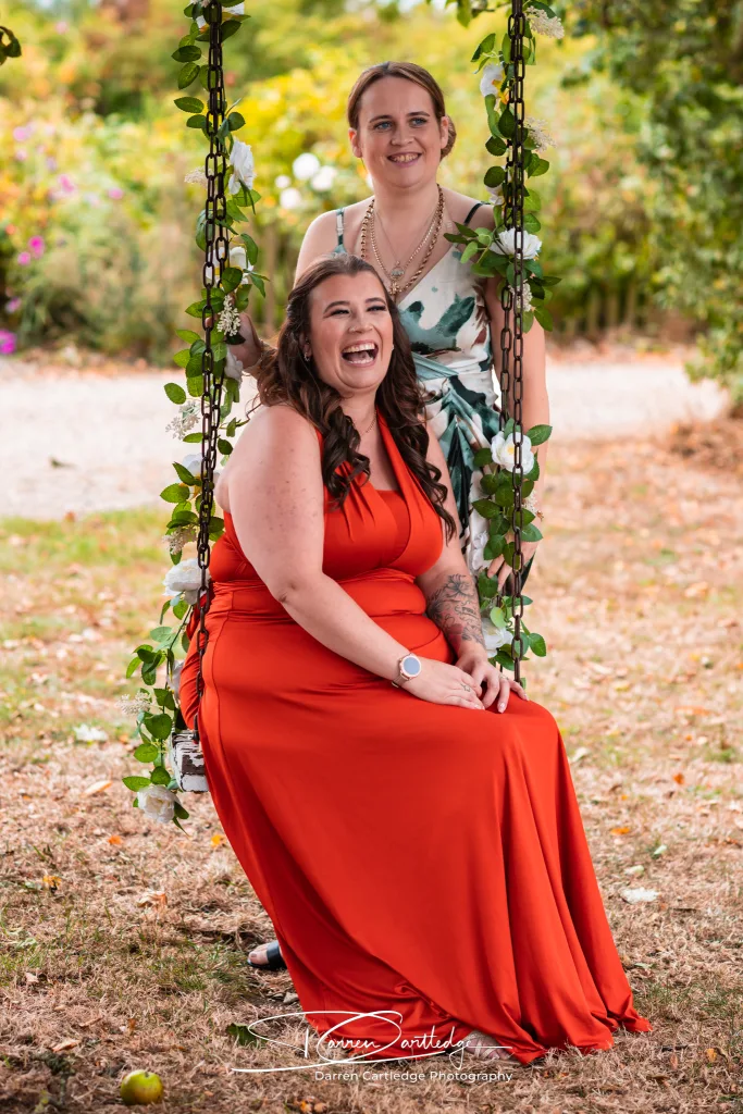 Bridesmaid relaxing on a swing at Clapham Holme Farm during a Yorkshire wedding
