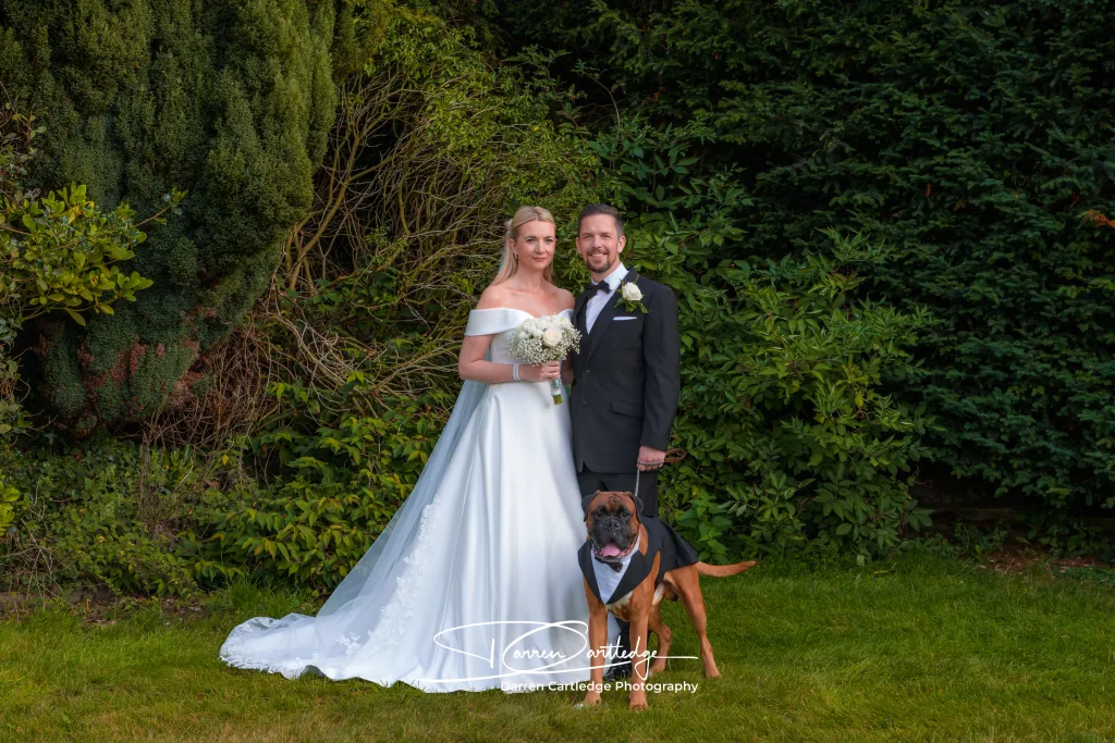 Bride and groom with their dog at Cleatham Hall during a Lincolnshire wedding