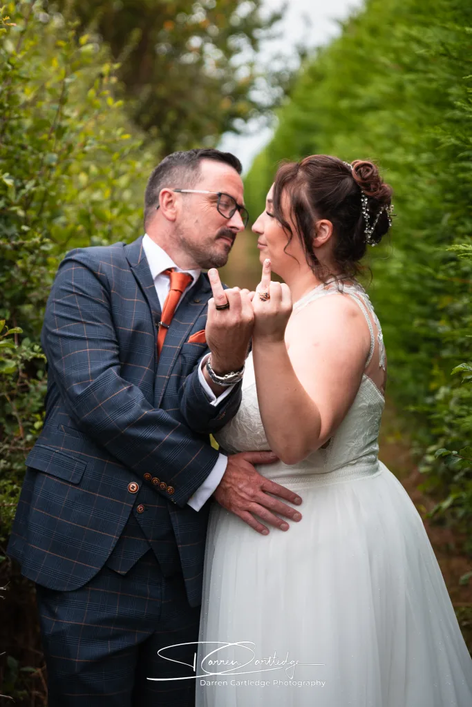 Bride and groom showing their wedding rings during a Yorkshire wedding