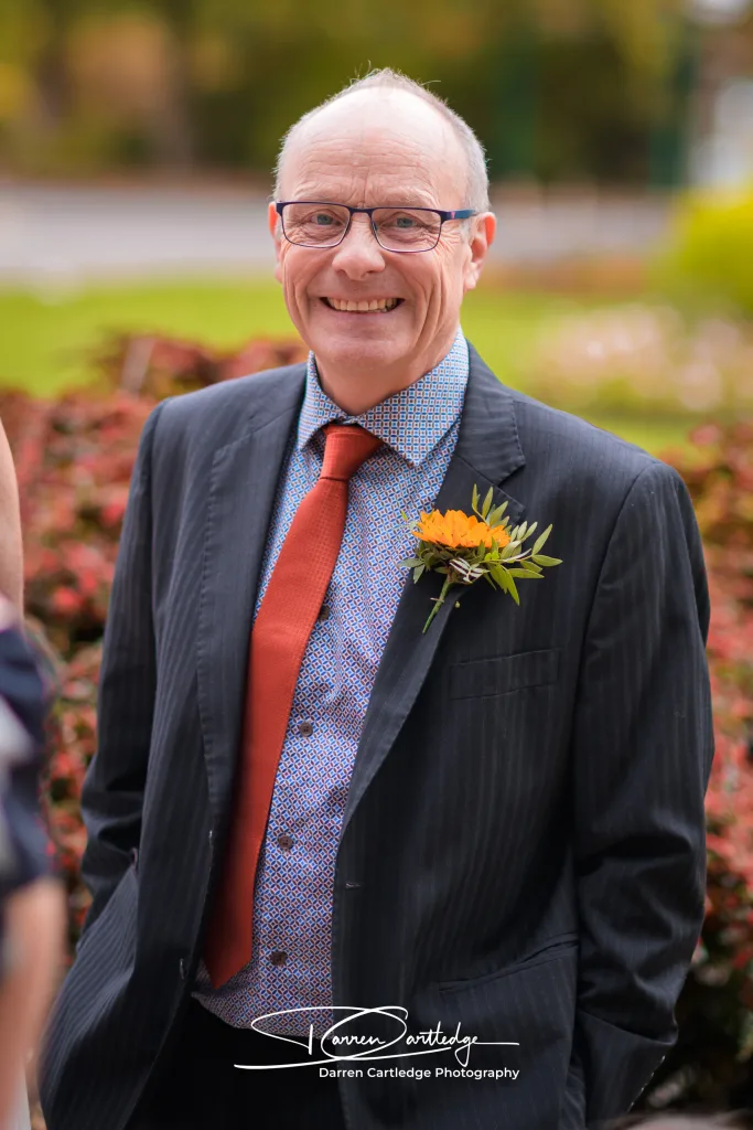 Father of the bride smiling at the camera during a Yorkshire wedding