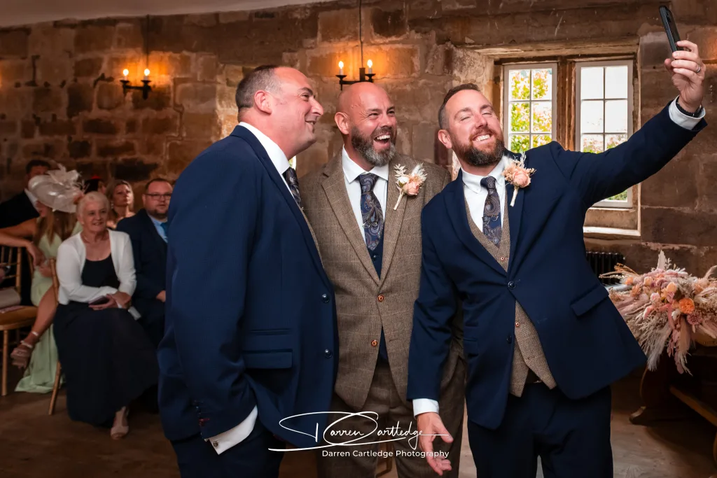 Groomsmen taking a selfie with the groom before the wedding ceremony at a Yorkshire wedding