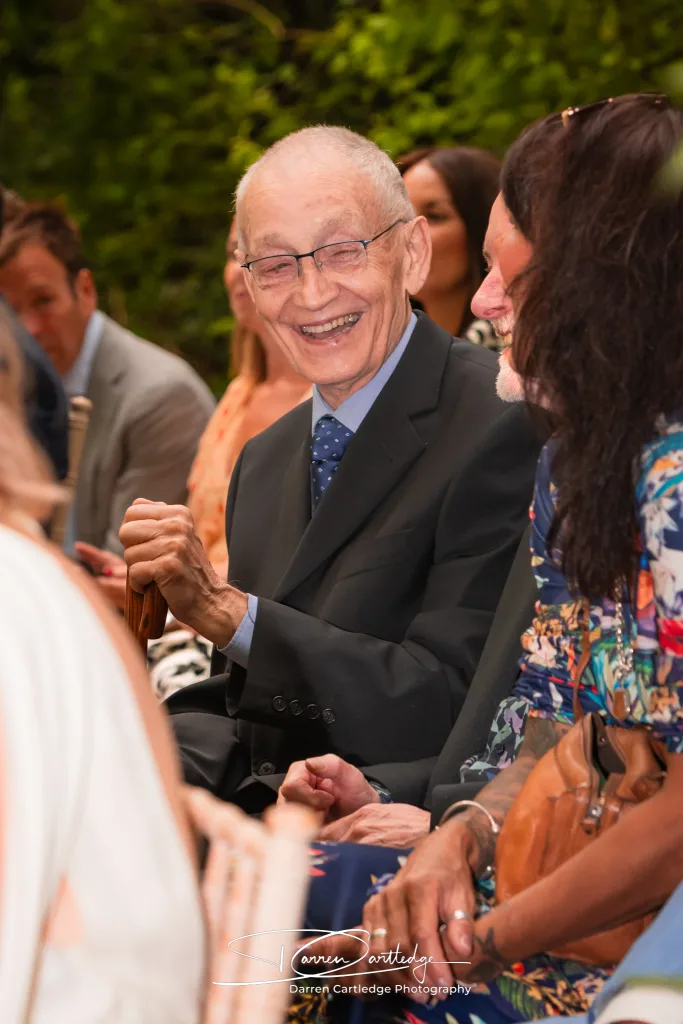 Wedding guest laughing at The Old Deanery in Ripon during a Yorkshire wedding