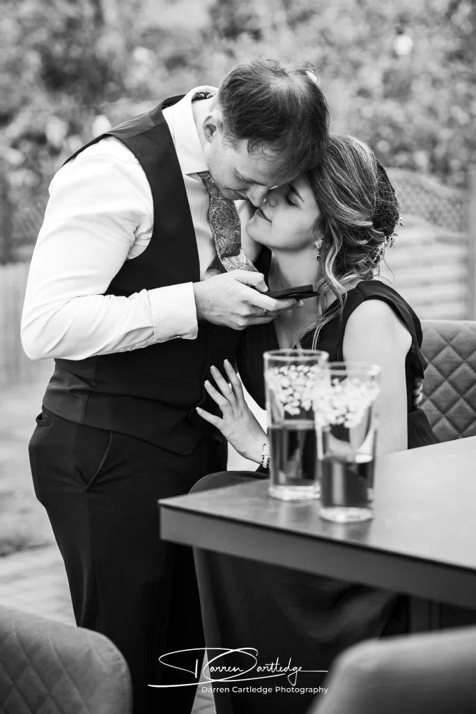 Intimate embrace between wedding guests at Willerby Barn during a Yorkshire wedding