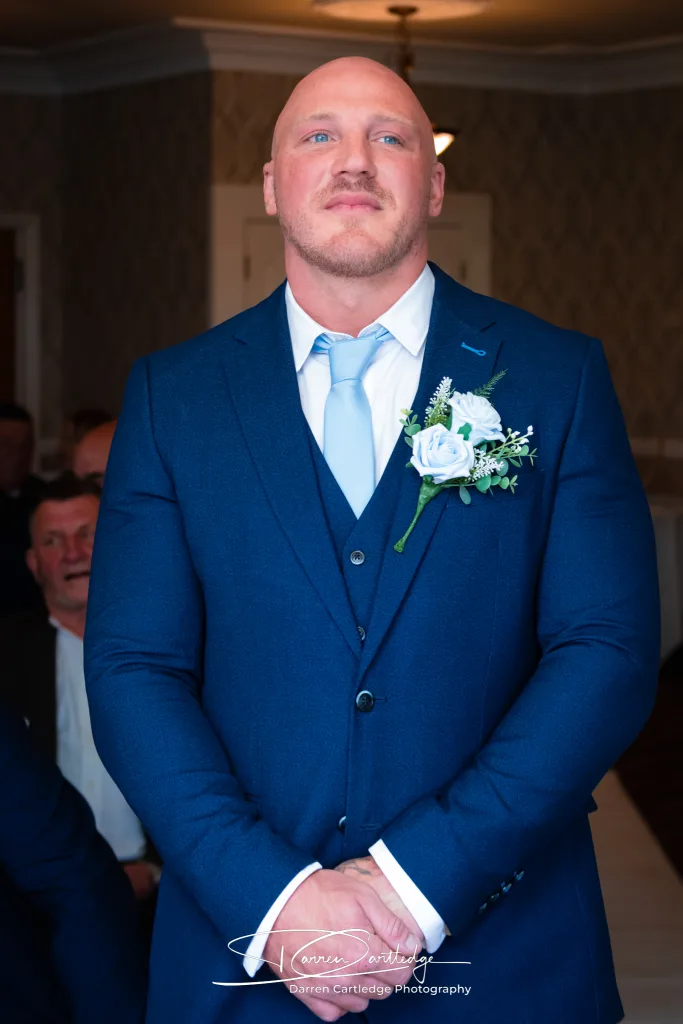 Nervous groom waiting for the bride’s entrance during a Yorkshire wedding ceremony
