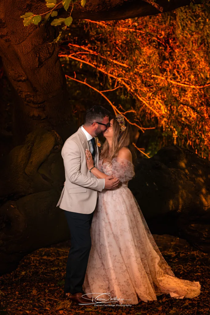 Bride and groom sharing a kiss in a romantic twilight portrait during a Yorkshire wedding