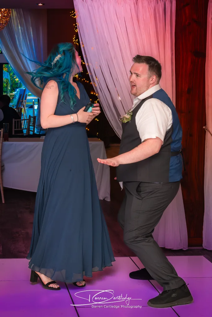Bridesmaid and groomsman dancing at a wedding at Willerby Barn in East Yorkshire
