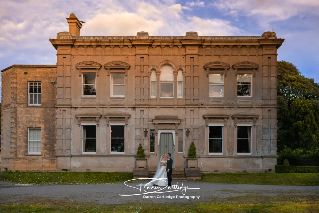 Couple sharing a kiss at Cleatham Hall wedding in Lincolnshire