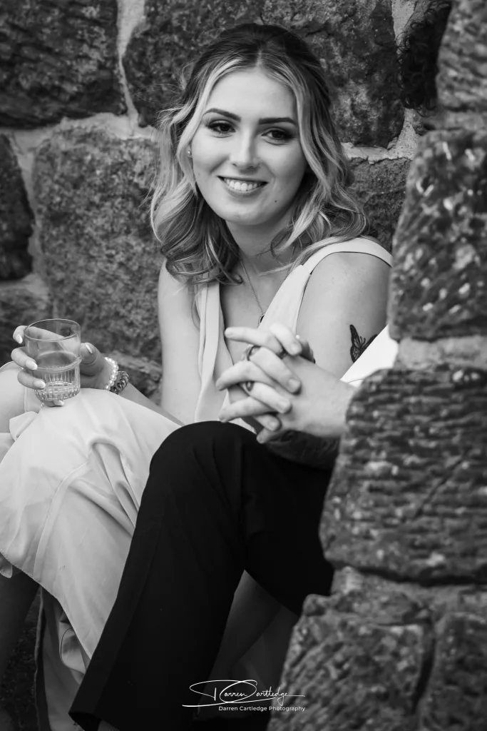 Bridesmaid taking a quiet moment during a wedding at Danby Castle, Yorkshire