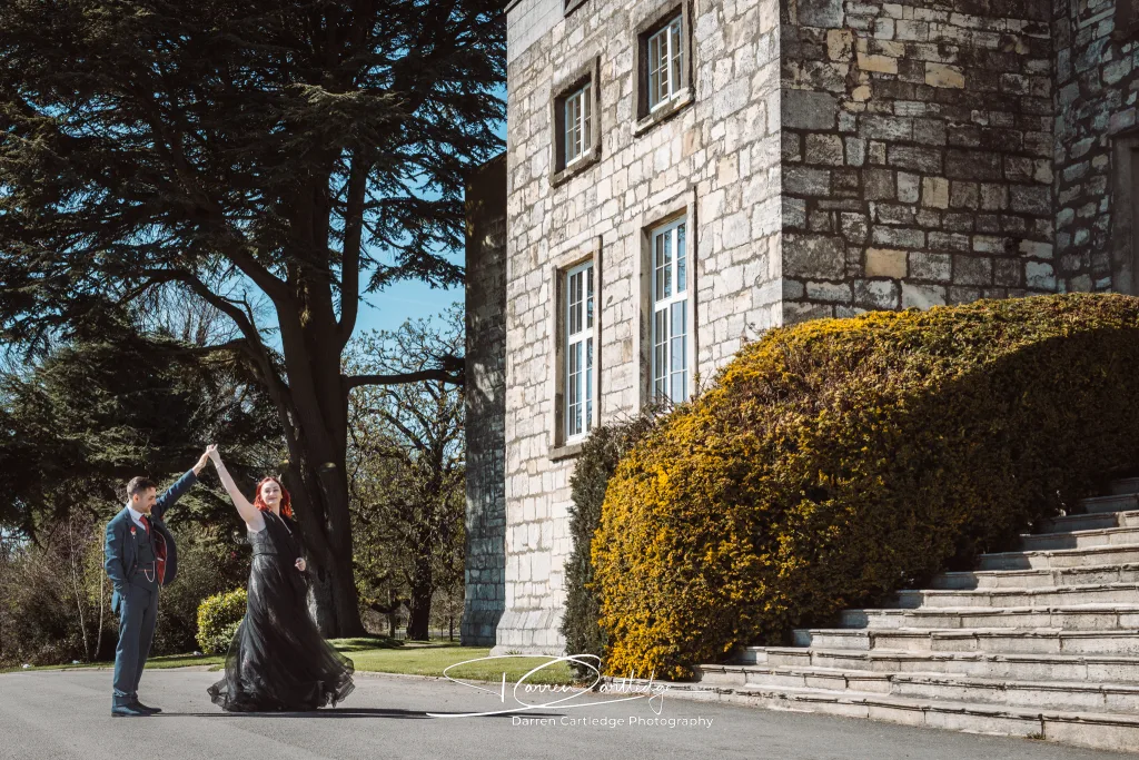 Couple outside Hazlewood Castle during a wedding in Yorkshire