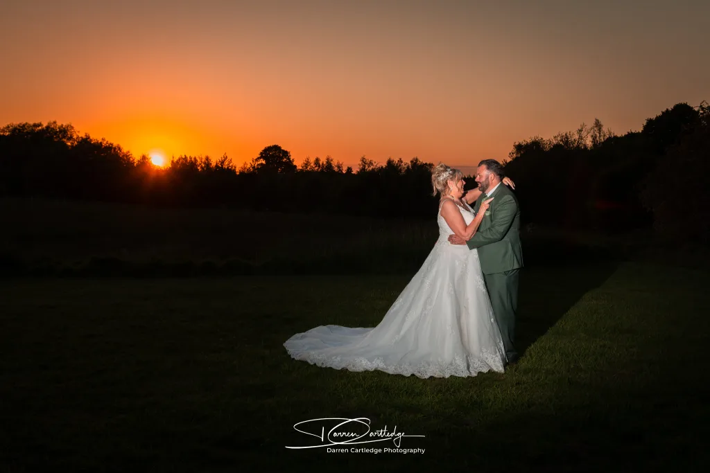 Bride and groom together at sunset during a wedding at Howard Court, Yorkshire